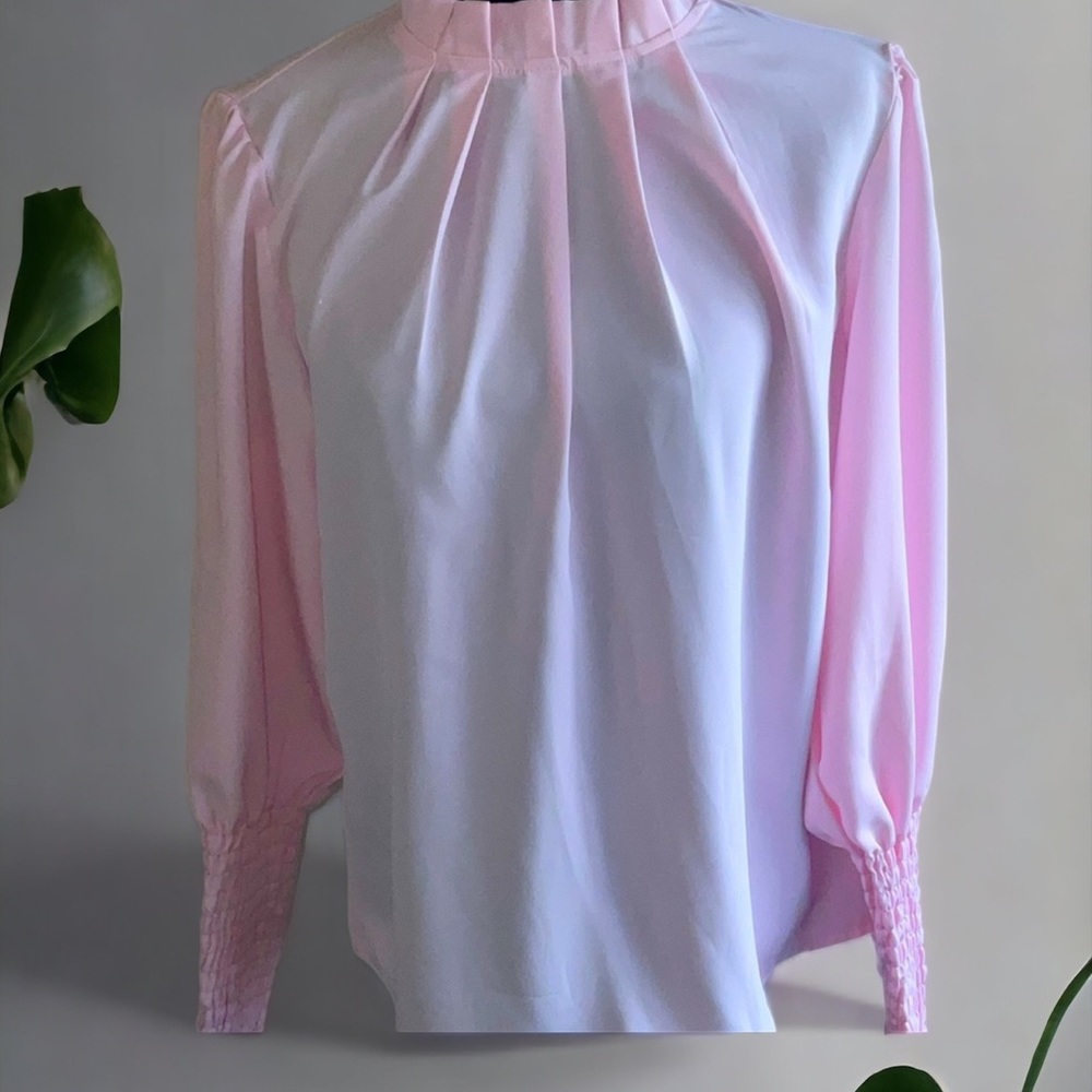 Long sleeve blouse with long sleeves.